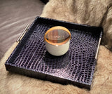 Indulge in the Bergamot and Clove Perfumed Estate Candle from One Preevay. Handcrafted with premium essential oils and soy wax, it features a stunning porcelain bowl with a silver-plated lid and leather strap. Elevate your ambiance for fathers day