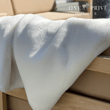 Indulge in the epitome of luxury with the One Preevay Faux Rabbit Fur Throw in Pure White. Inspired by the elegance of Fernando Botero and crafted from ultra-premium faux rabbit fur. Hypoallergenic, cruelty-free, over the sofa