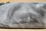 ONE Preevay's Faux Rabbit Fur Throw in Dramatic Gray. Inspired by Fernando Botero, crafted from Ultra Premium Faux Rabbit Fur. Hypoallergenic, cruelty-free, and lined with elegant velvet for refined warmth over the sofa .