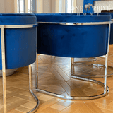 Discover_the_One_Preevay_Arc_Dining_Chair._Inspired_by_the_Arc_de_Triomphe_this_customizable_luxury_chair_features_a_nickel_frame_and_plush_velvet._Perfect_for_upscale_residences_and_hospitality_venues blue velvet ....