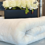 Indulge in the epitome of luxury with the One Preevay Faux Rabbit Fur Throw in Pure White. Inspired by the elegance of Fernando Botero and crafted from ultra-premium faux rabbit fur. Hypoallergenic, cruelty-free, and lined with elegant velvet for refined warmth and sophistication. 800gsm, 50x60 inches...