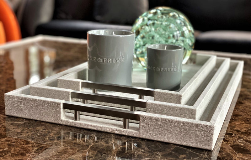 Discover the Thursby Shagreen Hotel Tray from One Preevay—a luxurious serving tray crafted with exotic embossed leather and nickel hardware. Available in three sizes: 17"x10", 20"x13", and 23"x15". Elevate your entertaining experience with sophistication and style. Order now......
