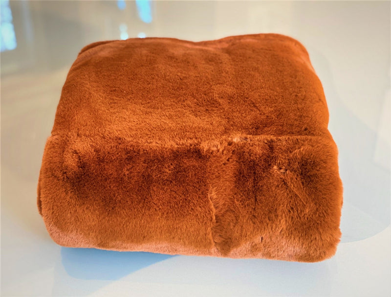 Experience luxury redefined with ONE Preevay's Faux Rabbit Fur Throw in Coco Brown. Inspired by Fernando Botero and crafted from Ultra Premium Faux Rabbit Fur. Hypoallergenic, cruelty-free, and lined with elegant velvet for refined warmth and sophistication. 800gsm 50x60 inches