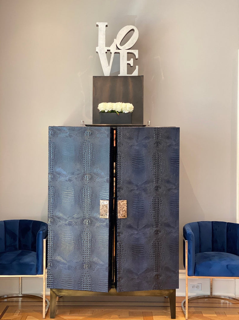 Experience ultra-luxury with One Preevay's bespoke Crocodile Armoire. Inspired by Louis XIV, this customizable piece combines elegance & functionality. Handcrafted with faux crocodile leather, ebony wood & marble handles....