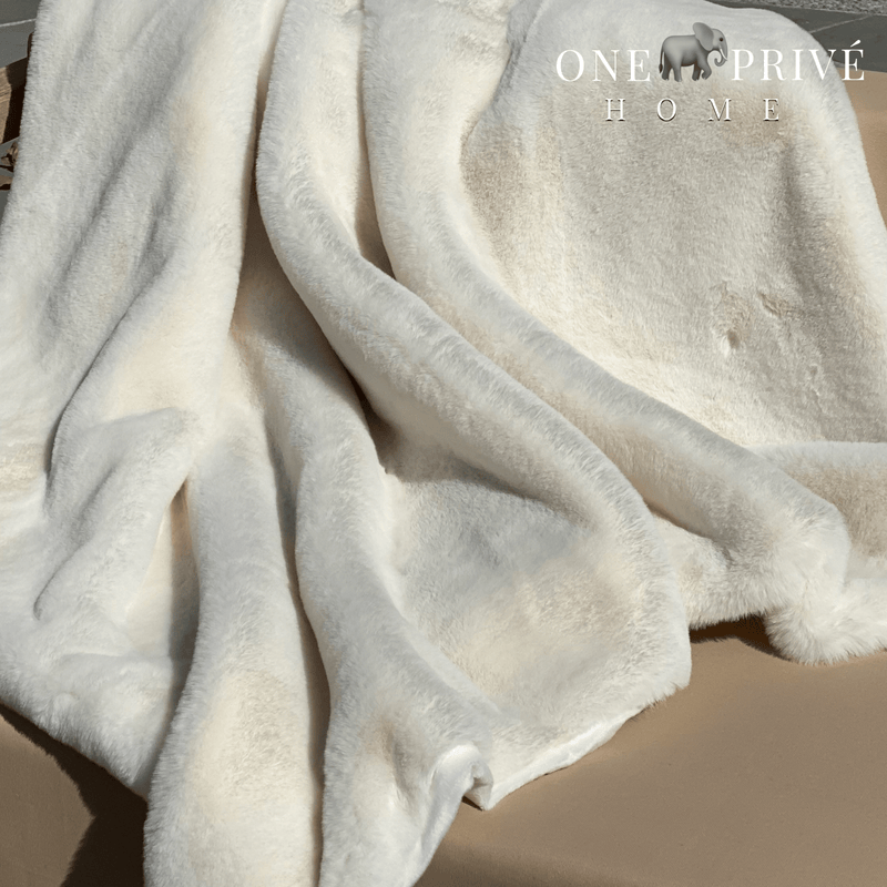 Indulge in the epitome of luxury with the One Preevay Faux Rabbit Fur Throw in Pure White. Inspired by the elegance of Fernando Botero and crafted from ultra-premium faux rabbit fur. Hypoallergenic, cruelty-free, and lined with elegant velvet for refined warmth and sophistication. 800gsm, 50x60 inches...outdoor
