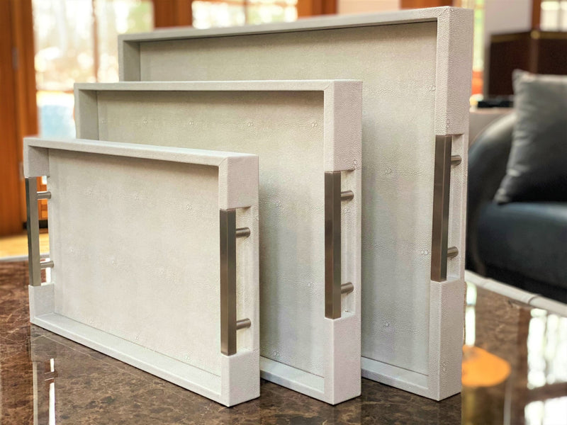 Luxury shagreen serving tray with inlaid nickel handles and ivory velvet underside"
Thursby Shagreen Hotel Tray - exotic embossed leather and nickel accents High-end serving tray with shagreen leather, inlaid nickel handles, and velvet underside" "Luxury entertaining tray - Thursby Shagreen, embossed leather, nickel handles"
"Shagreen leather serving tray with inlaid nickel handles and elegant design"
Luxury serving trays
Shagreen leather trays three corner glass