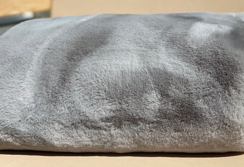 ONE Preevay's Faux Rabbit Fur Throw in Dramatic Gray. Inspired by Fernando Botero, crafted from Ultra Premium Faux Rabbit Fur. Hypoallergenic, cruelty-free, and lined with elegant velvet for refined warmth over the sofa .