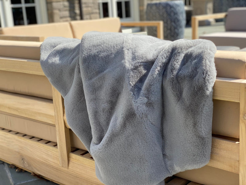 ONE Preevay's Faux Rabbit Fur Throw in Dramatic Gray. Inspired by Fernando Botero, crafted from Ultra Premium Faux Rabbit Fur. Hypoallergenic, cruelty-free, and lined with elegant velvet for refined warmth over the sofa layout....