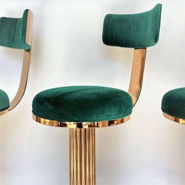 Atlas luxury Art Deco bar stool with custom bronze finish and premium velvet upholstery, showing Chrysler Building inspired design details.