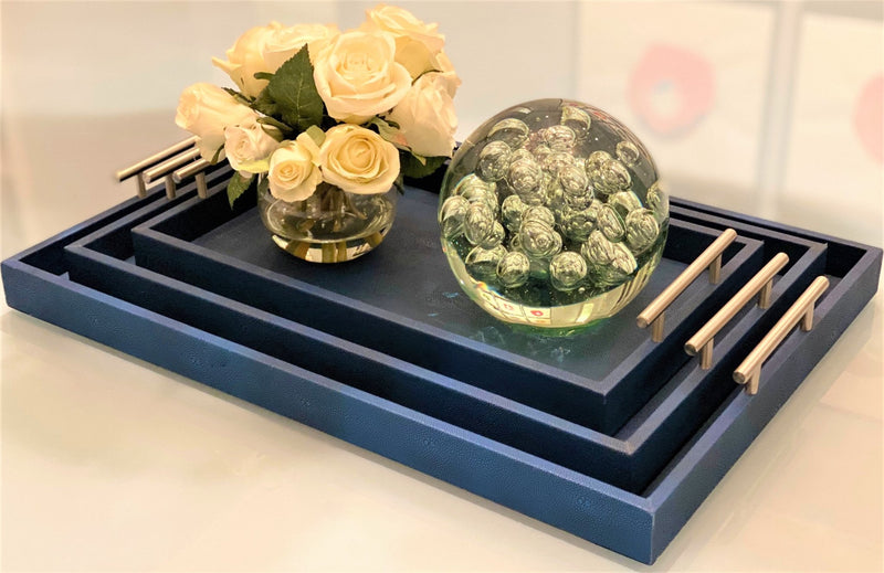 Discover the Canaan Shagreen Serving Tray from One Preevay—a luxurious tray crafted with sea blue exotic embossed leather and nickel hardware. Available in three sizes: 17"x10", 20"x13", and 23"x15". Elevate your entertaining experience with sophistication and style today.