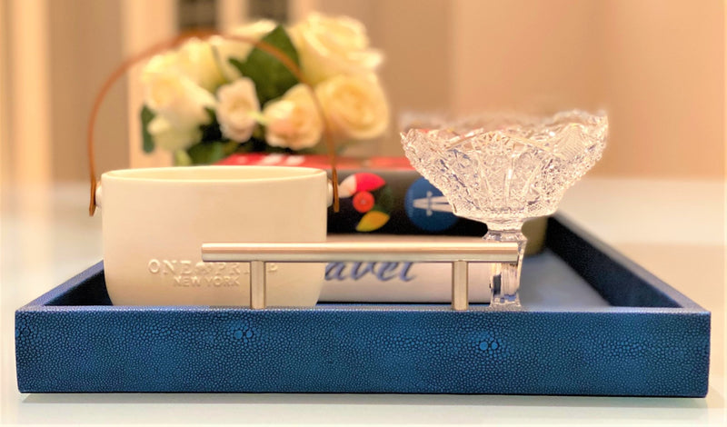 Discover the Canaan Shagreen Serving Tray from One Preevay—a luxurious tray crafted with sea blue exotic embossed leather and nickel hardware. Available in three sizes 17"x10", 20"x13", and 23"x15". Elevate your entertaining experience with sophistication and style. Order now.
