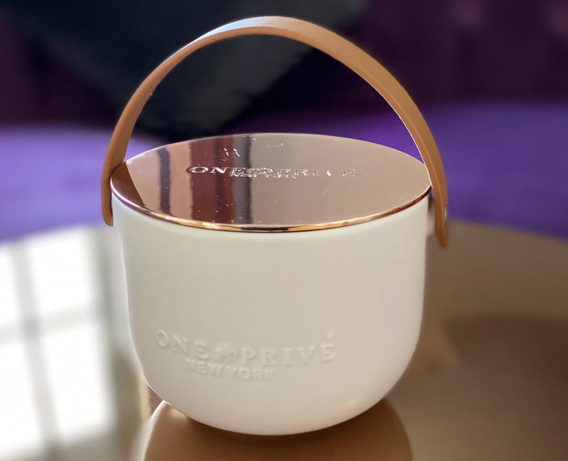 Discover the Grapefruit Neroli Perfumed Estate Candle from One Preevay. Handcrafted with premium essential oils and soy wax, it features a porcelain bowl with a silver-plated lid and leather strap. Enjoy the aromatic fusion of grapefruit and neroli. Order now to elevate your ambiance at home or work
