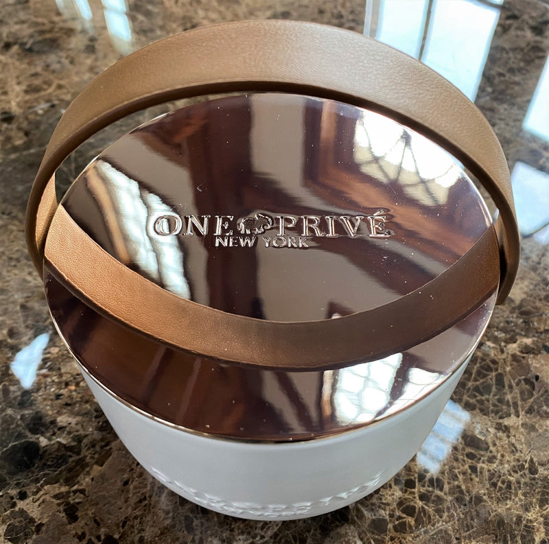 Discover the Grapefruit Neroli Perfumed Estate Candle from One Preevay. Handcrafted with premium essential oils and soy wax, it features a porcelain bowl with a silver-plated lid and leather strap. Enjoy the aromatic fusion of grapefruit and neroli. Order now to elevate your ambiance of leather. 