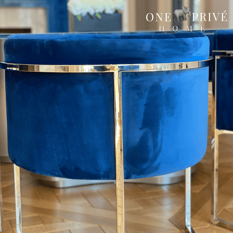Discover the One Preevay Arc Dining Chair. Inspired by the Arc de Triomphe, this customizable luxury chair features a nickel frame and plush velvet. Perfect for upscale residences and hospitality venues. Minimum order of 8 chairs window light rear