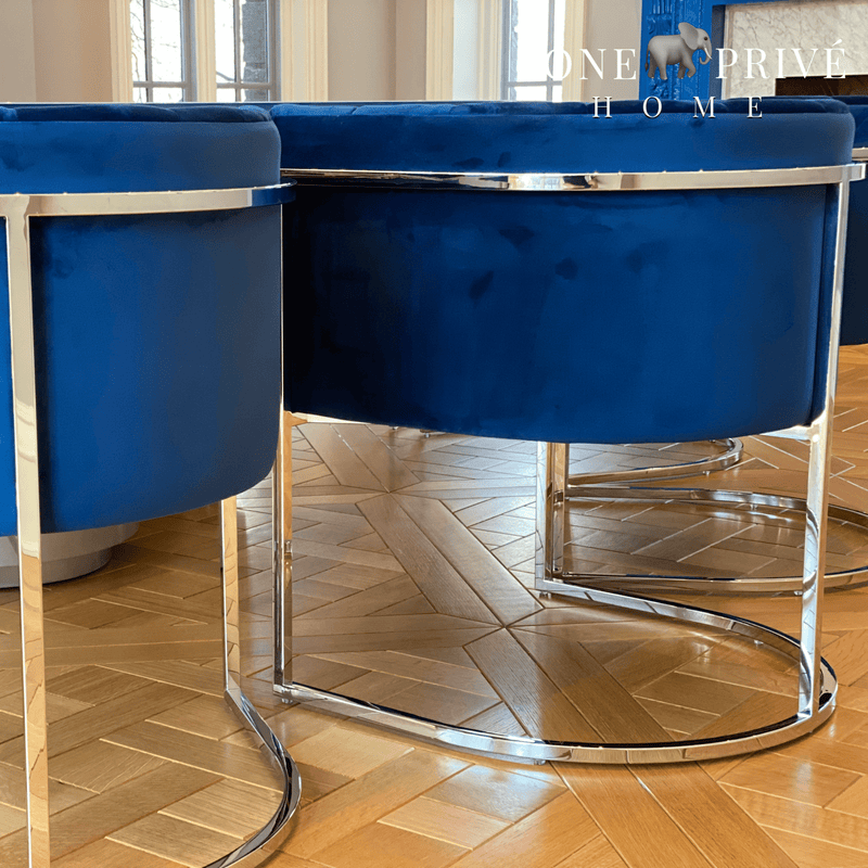 Discover_the_One_Preevay_Arc_Dining_Chair._Inspired_by_the_Arc_de_Triomphe_this_customizable_luxury_chair_features_a_nickel_frame_and_plush_velvet._Perfect_for_upscale_residences_and_hospitality_venues blue velvet ....