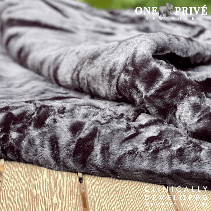 Experience luxurious relaxation with the One Preevay Luxury Home Furnishings, world's first weighted faux rabbit fur blanket, inspired by Fernando Botero. Clinically developed, 20lbs, queen size, and hypoallergenic warmth