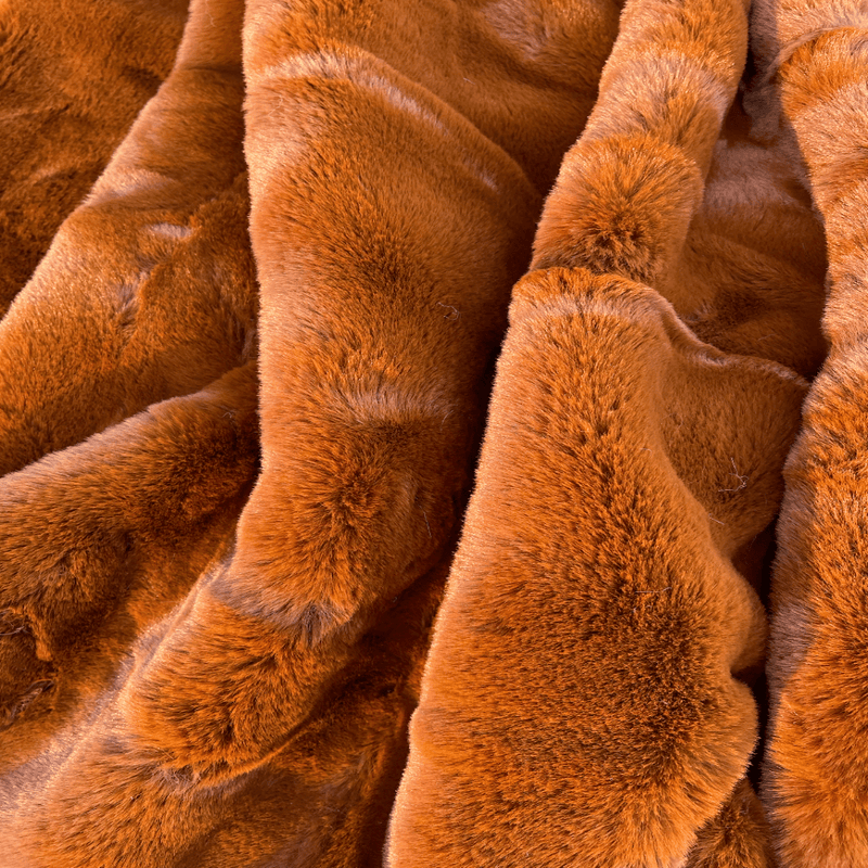 Experience luxury redefined with ONE Preevay's Faux Rabbit Fur Throw in Coco Brown. Inspired by Fernando Botero and crafted from Ultra Premium Faux Rabbit Fur. Hypoallergenic, cruelty-free, and lined with elegant velvet for refined warmth and sophistication. 800gsm, 50x60 inches.
