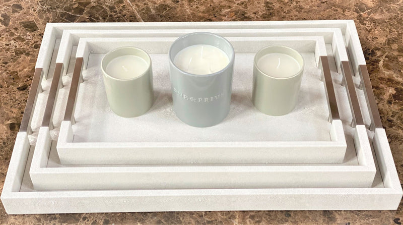 Discover the Thursby Shagreen Hotel Tray from One Preevay—a luxurious serving tray crafted with exotic embossed leather and nickel hardware. Available in three sizes: 17"x10", 20"x13", and 23"x15". Elevate your entertaining experience with sophistication and style. Order now......
