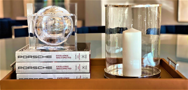 Porsche-Style Pierre Carmel Leather Tray | Handcrafted Premium Leather | Nickel Hardware. Limited Edition.&nbsp;

Elevate Your Entertaining Experience

Inspired by the iconic designs of Porsche, the Pierre Porsche-Inspired Carmel Leather Hotel Tray embodies the perfect blend of style and serenity. This exquisite piece features: